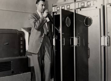 Interior of a State Radio transmitter site with generator and equipment rack
